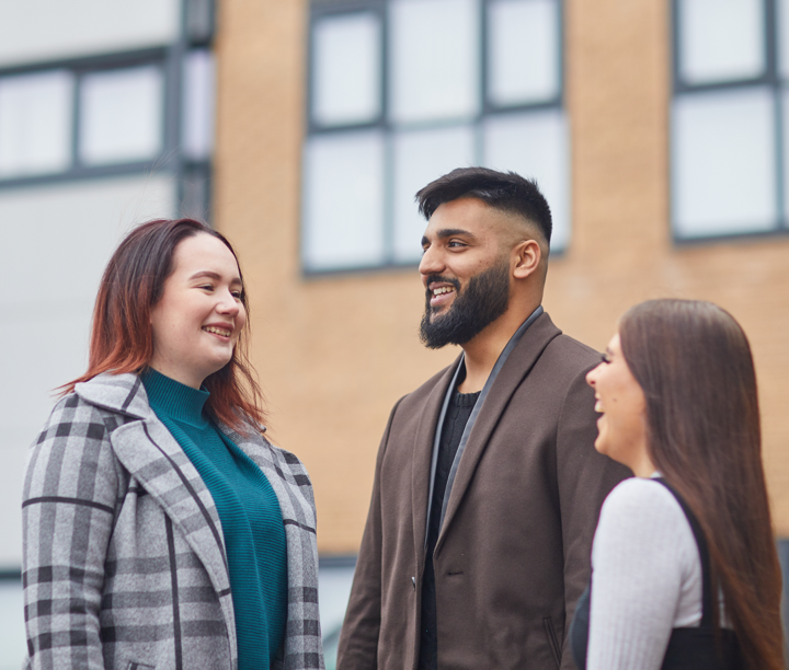 group of 3 people chatting