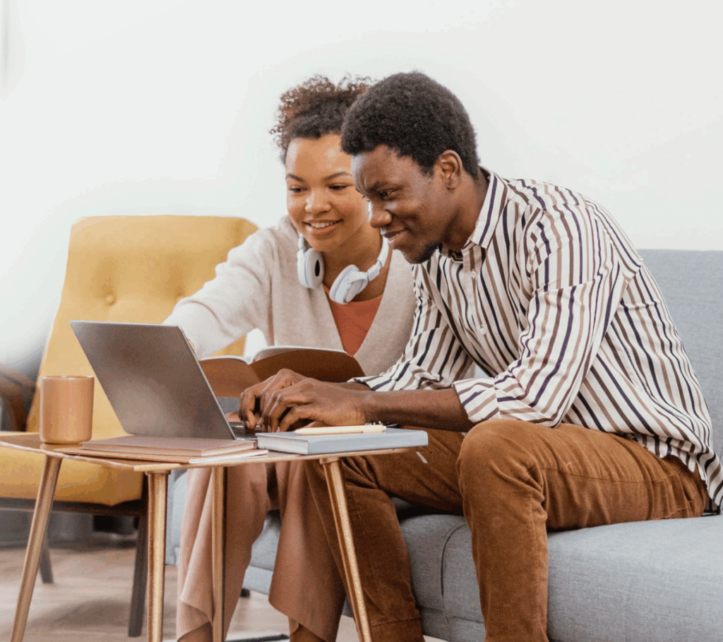 two people looking at laptop